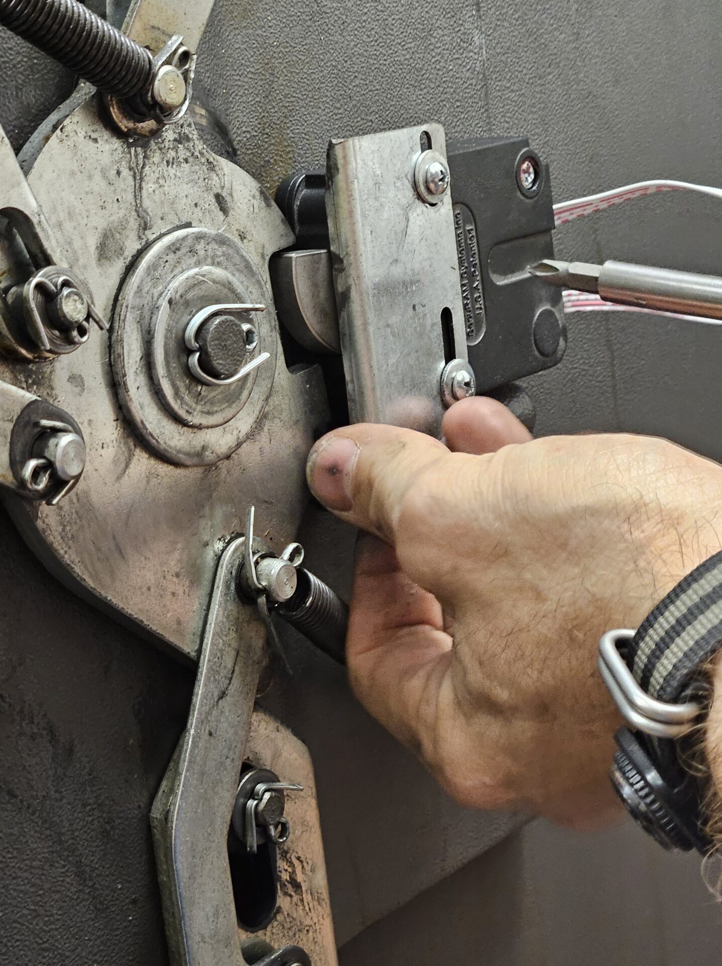 An Able Locksmiths Safe Technician services and changes the combination of a safe.